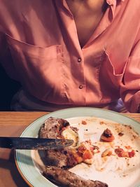 Close-up of man having food