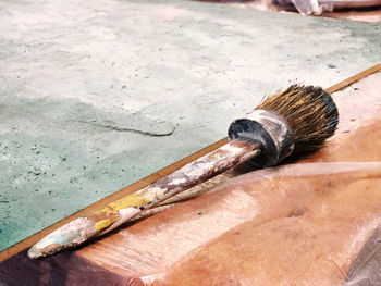 High angle view of paintbrushes on floor