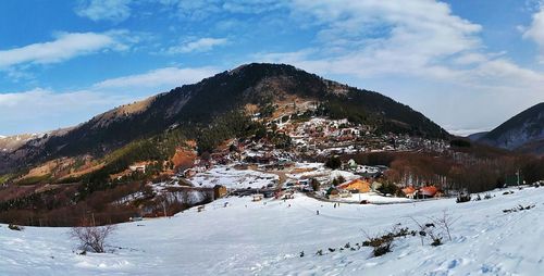 Scenic view of snowcapped mountains against sky