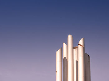 Low angle view of smoke stack against sky