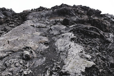 Rock formations on landscape against sky