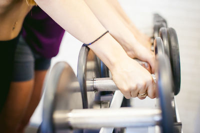 Midsection of women exercising in gym