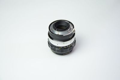 Close-up of camera over white background