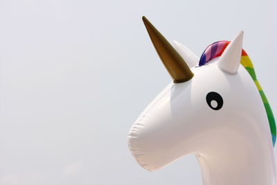 Close-up of stuffed toy over white background