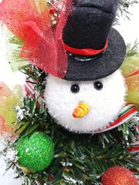 Close-up of christmas decorations in snow