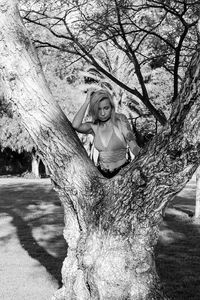 Woman standing by tree at kit carson park