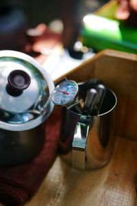 High angle view of clock on table