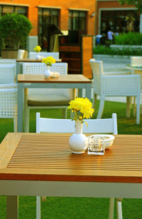 Flower vase on table at restaurant