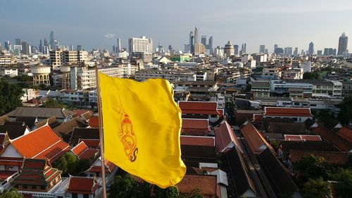 Panoramic view of buildings in city against sky