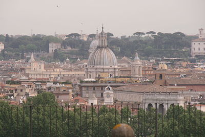 Panoramic view of buildings in city against sky