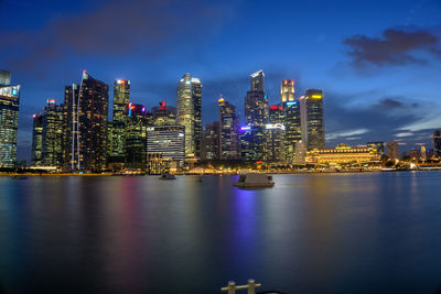 Illuminated city at waterfront