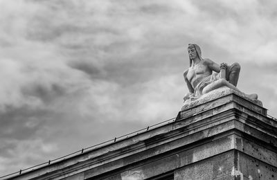 Low angle view of statue against sky