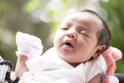 Close-up of cute baby girl sleeping