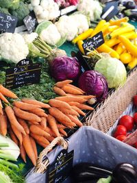 Vegetables with price tag for sale at market stall