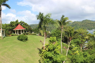 Scenic view of trees and buildings against sky