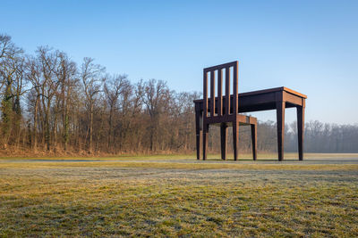 Built structure on field against clear sky