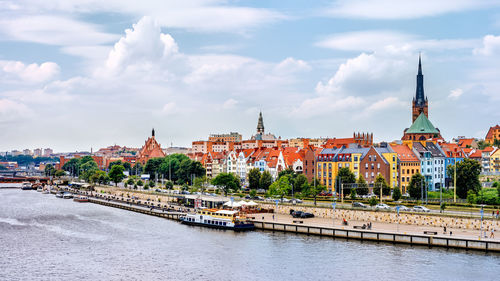 View of buildings against cloudy sky