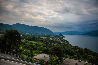 Scenic view of buildings and mountains against sky