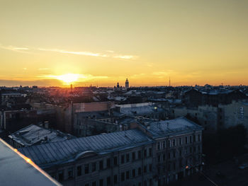 High angle view of cityscape against sky during sunset