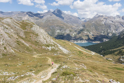 Hiker on the peaks of the vanoise massif in the alps in summer