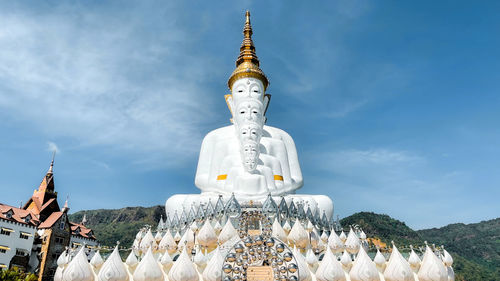 Low angle view of statue against sky