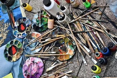 High angle view of paintbrushes on floor