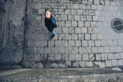 High angle portrait of man standing on street