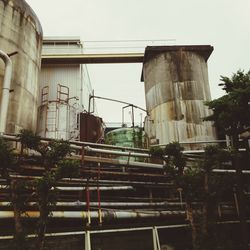 Low angle view of factory against sky