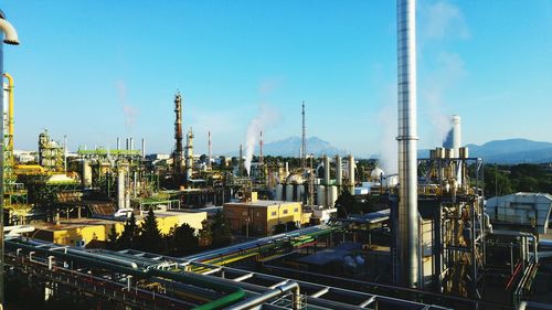View of cityscape against blue sky