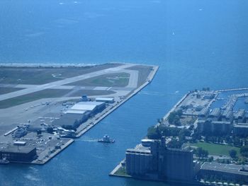 High angle view of commercial dock against blue sky