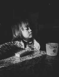 Portrait of a girl sitting on table