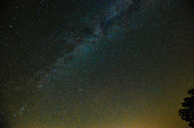 Low angle view of stars in sky at night