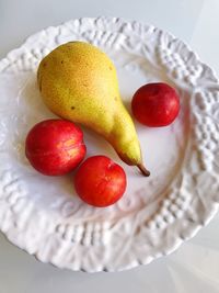 High angle view of apples in plate on table