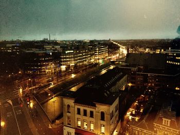 High angle view of illuminated cityscape at night