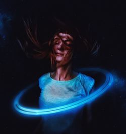 Close-up of woman with light painting