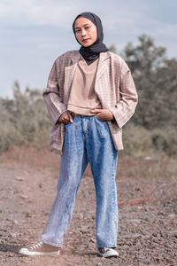 Portrait of man standing on land