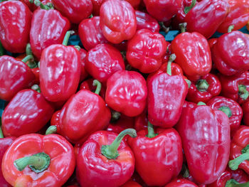 Full frame shot of red bell peppers for sale in market