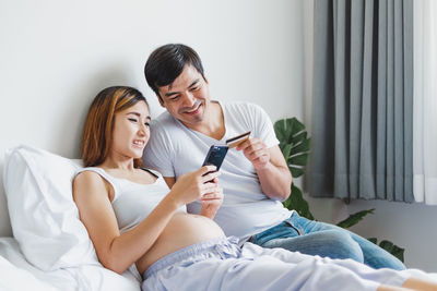 Young couple looking at camera