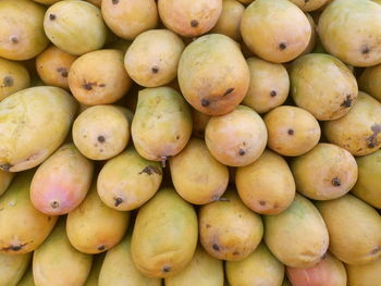 Full frame shot of mangoes at market stall for sale