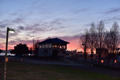 Built structure against cloudy sky at sunset