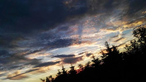 Low angle view of cloudy sky at sunset