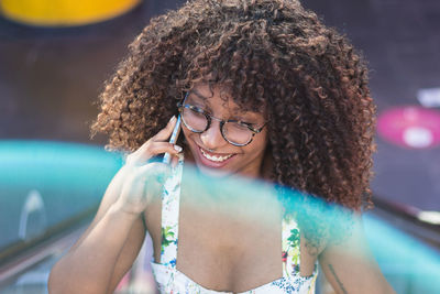 Portrait of smiling young woman in swimming pool