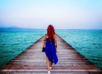 Rear view of woman looking at sea