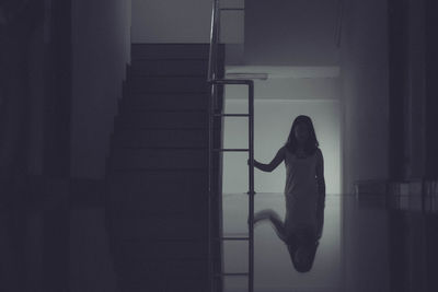 Side view of woman at home