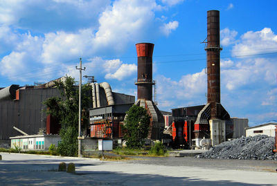 Buildings against cloudy sky