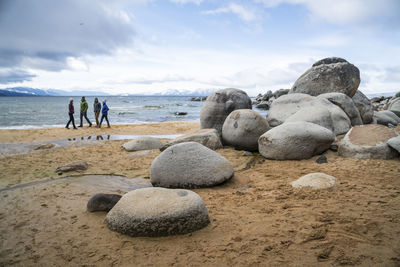 Group of friends together on beach