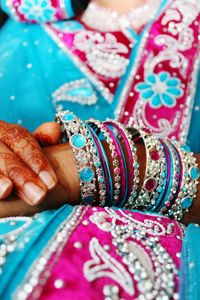 Midsection of bride wearing bangles