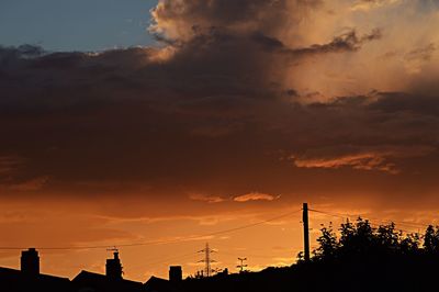 Silhouette of built structure at sunset