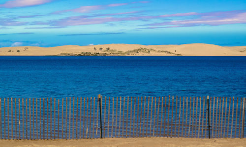 Scenic view of sea against blue sky