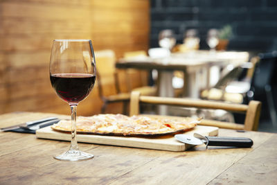 Close-up of wine in glass on table